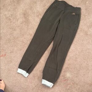 Adidas Green Track Pants with Elastic Cuffs and Tapered Leg